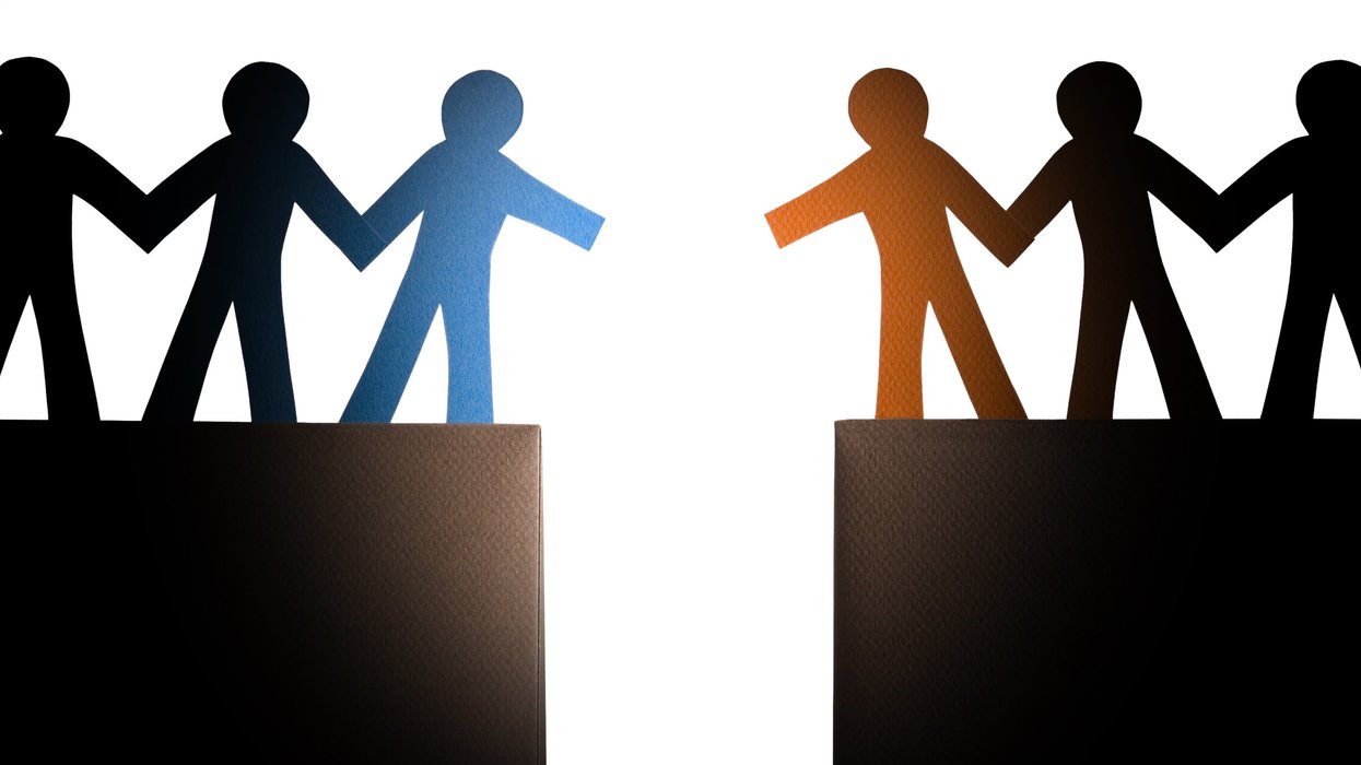 Two groups of people approaching each other over a chasm, ready to shake hands.