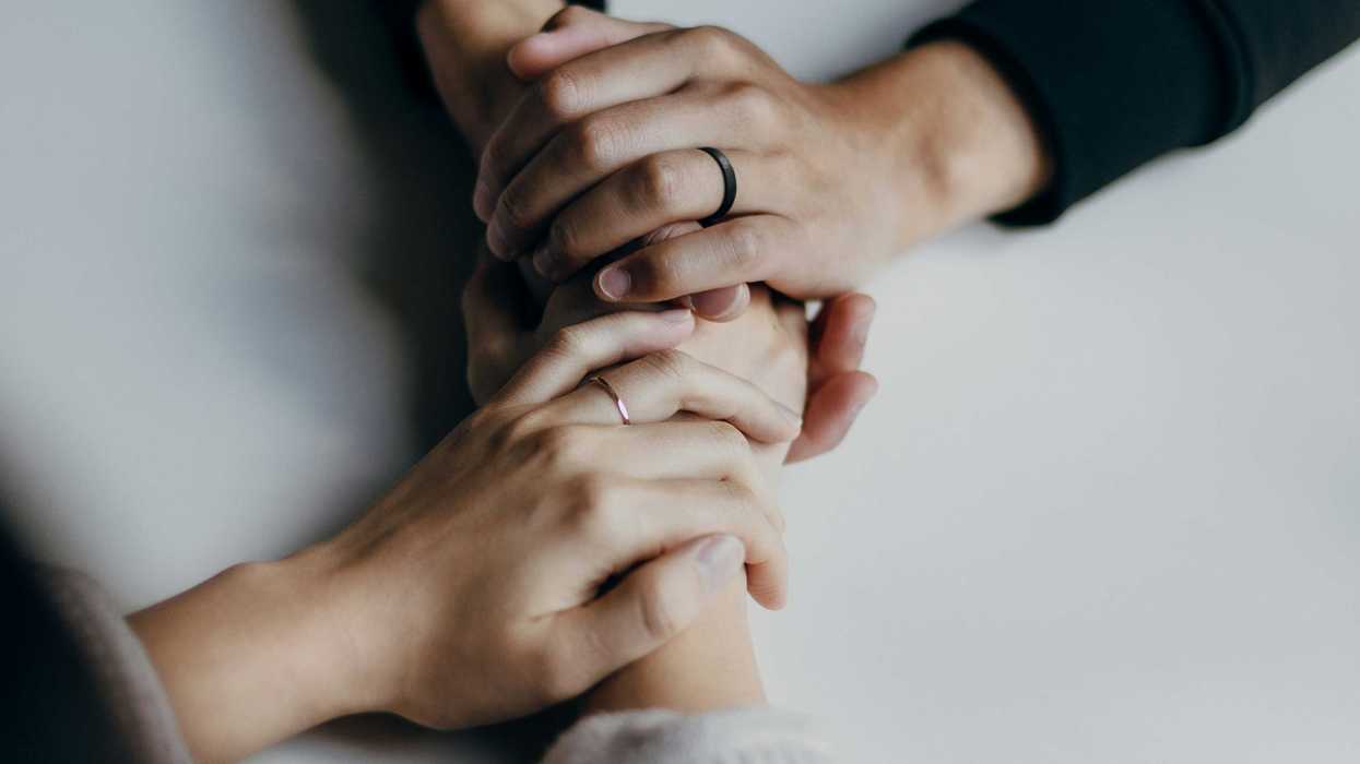 two people holding hands