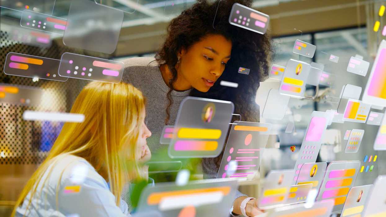 Two people looking at screens.