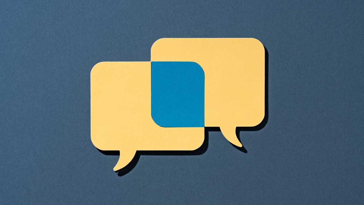 Two Yellow Speech Bubbles Overlapping Common Ground on Blue Background Front View.
