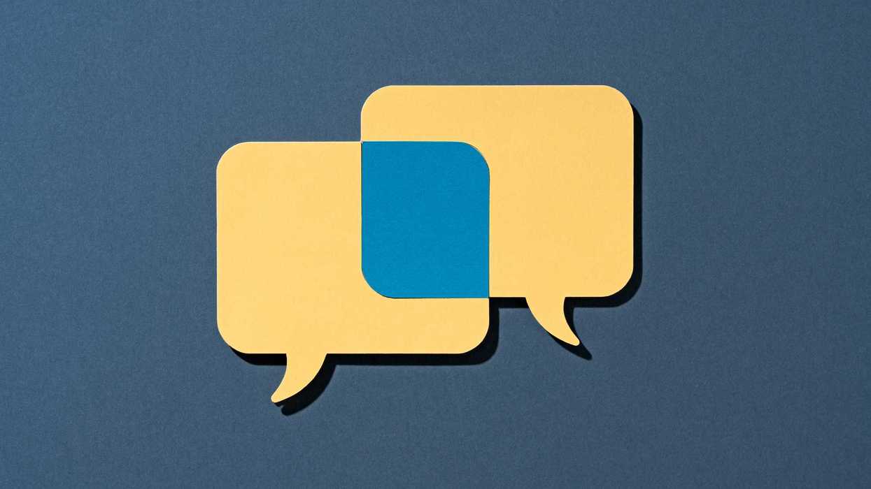 Two Yellow Speech Bubbles Overlapping Common Ground on Blue Background Front View.