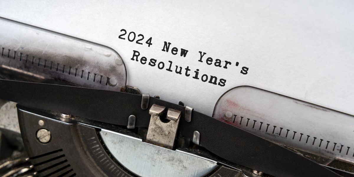 Typewriter with paper that reads "2024 New Year's Resolutions"