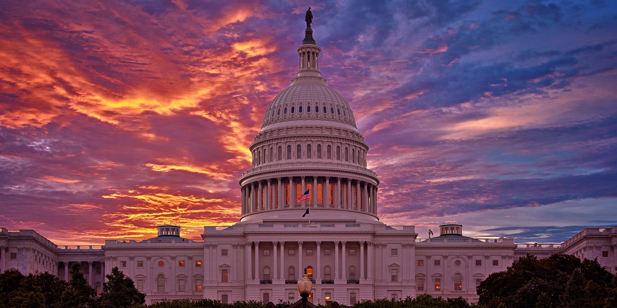 U.S. Capitol with red and blue clouds