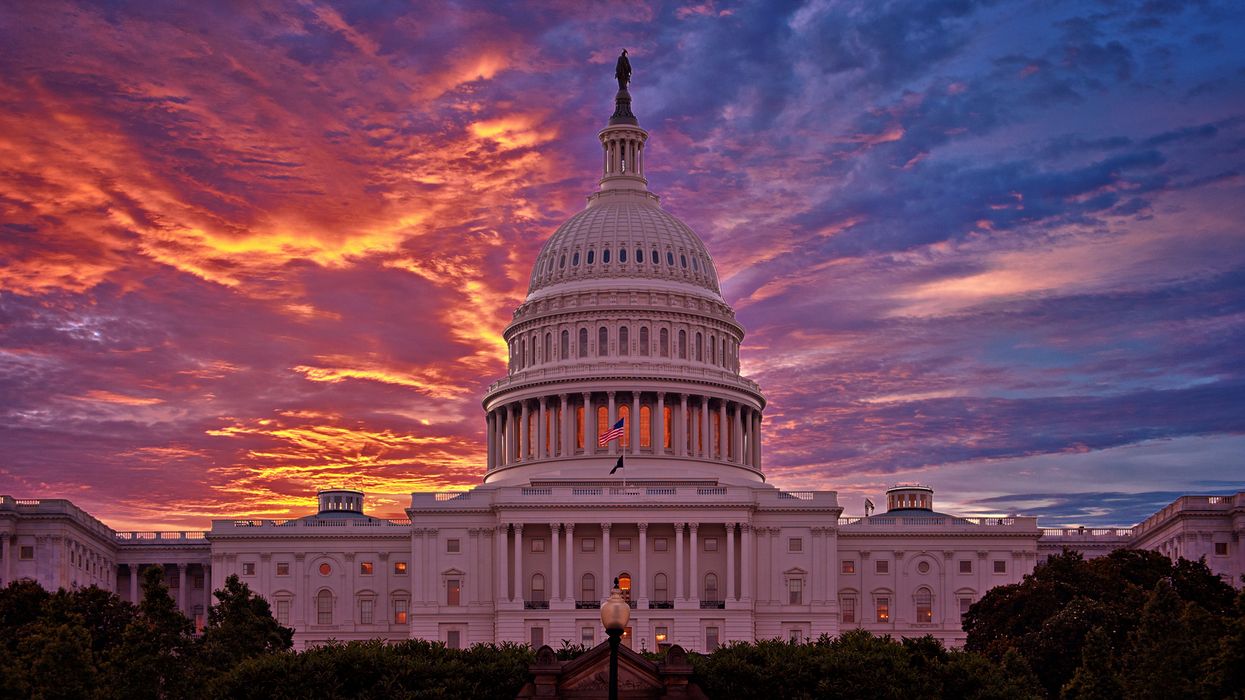U.S. Capitol with red and blue clouds