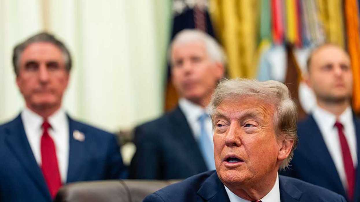 U.S. President Donald Trump sitting in the Oval Office.