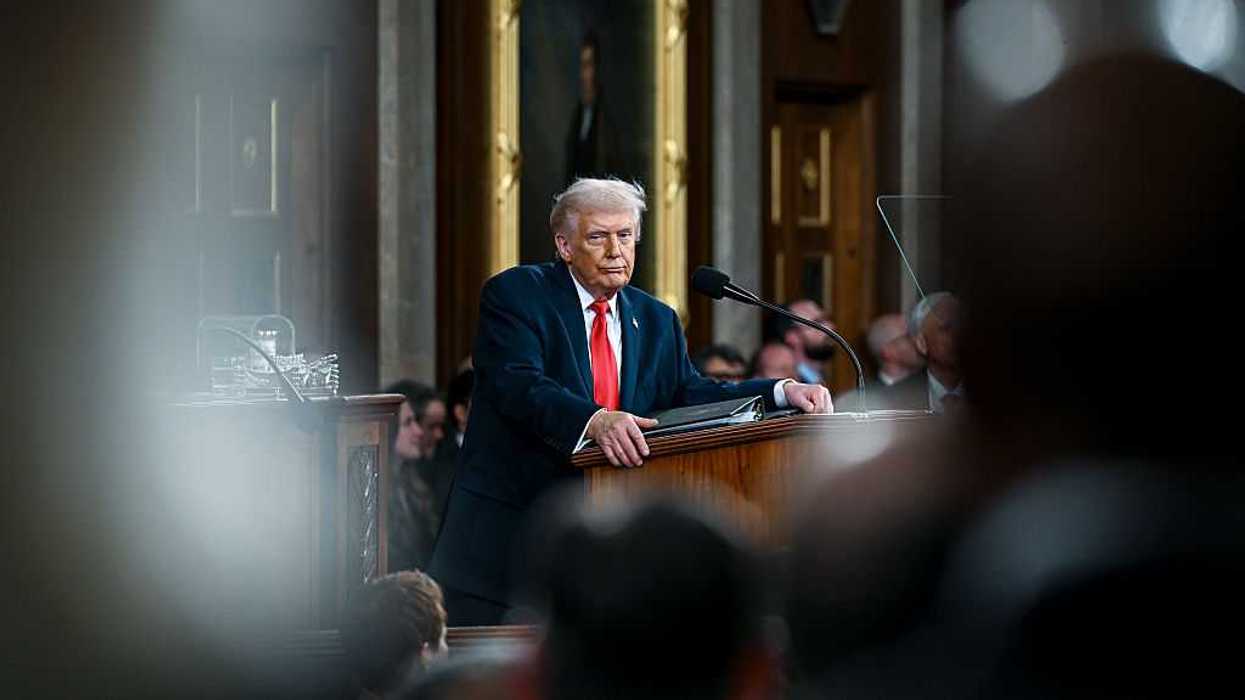 U.S. President Donald Trump standing at a podium.