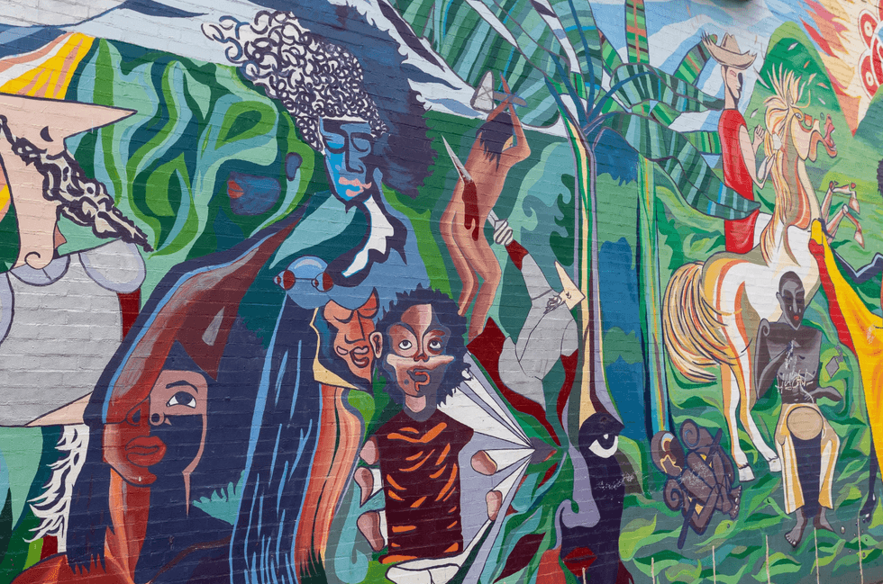 \u201cLa Voz del Paseo Boricua\u201d (The Voice of Paseo Boricua) mural in Humboldt Park by artist Cristian Rold\u00e1n