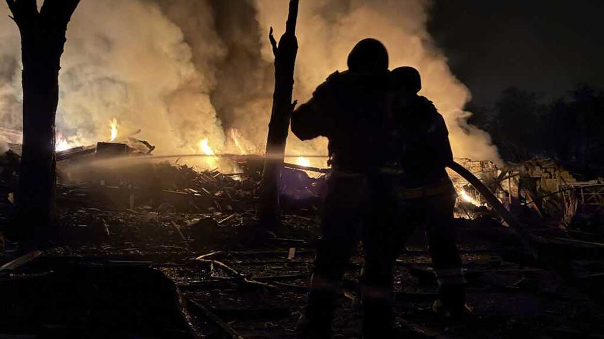 Ukrainian rescuers at night