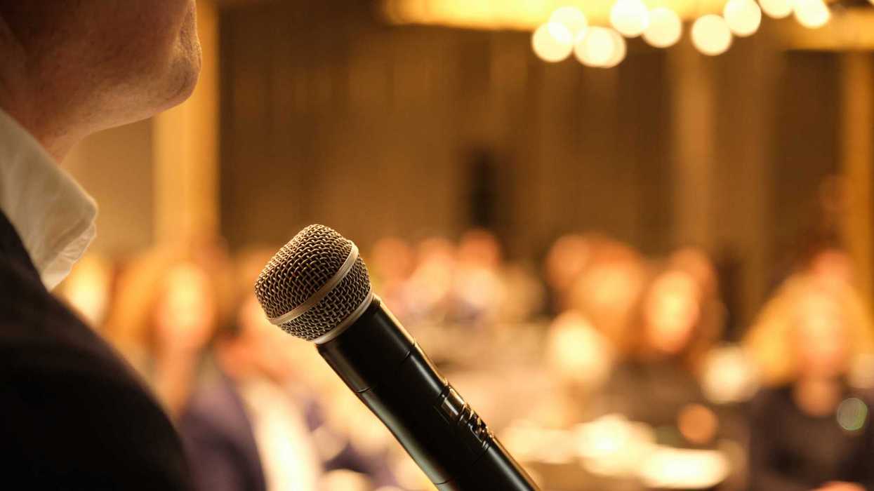 unrecognizable businessman giving speech to professional audience