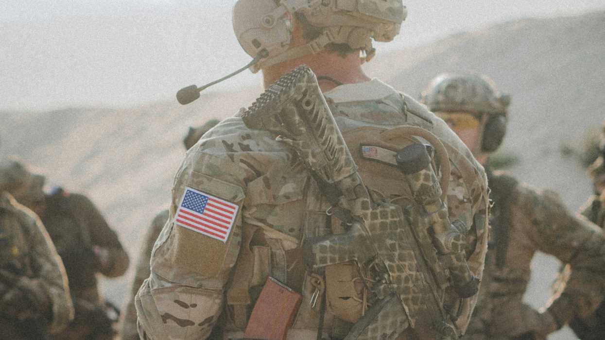 US soldier with American flag patch on his arm.