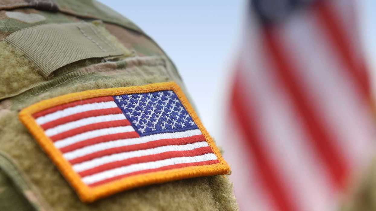 Veterans Day. US soldiers. US army. USA patch flag on the US military uniform and USA flag.