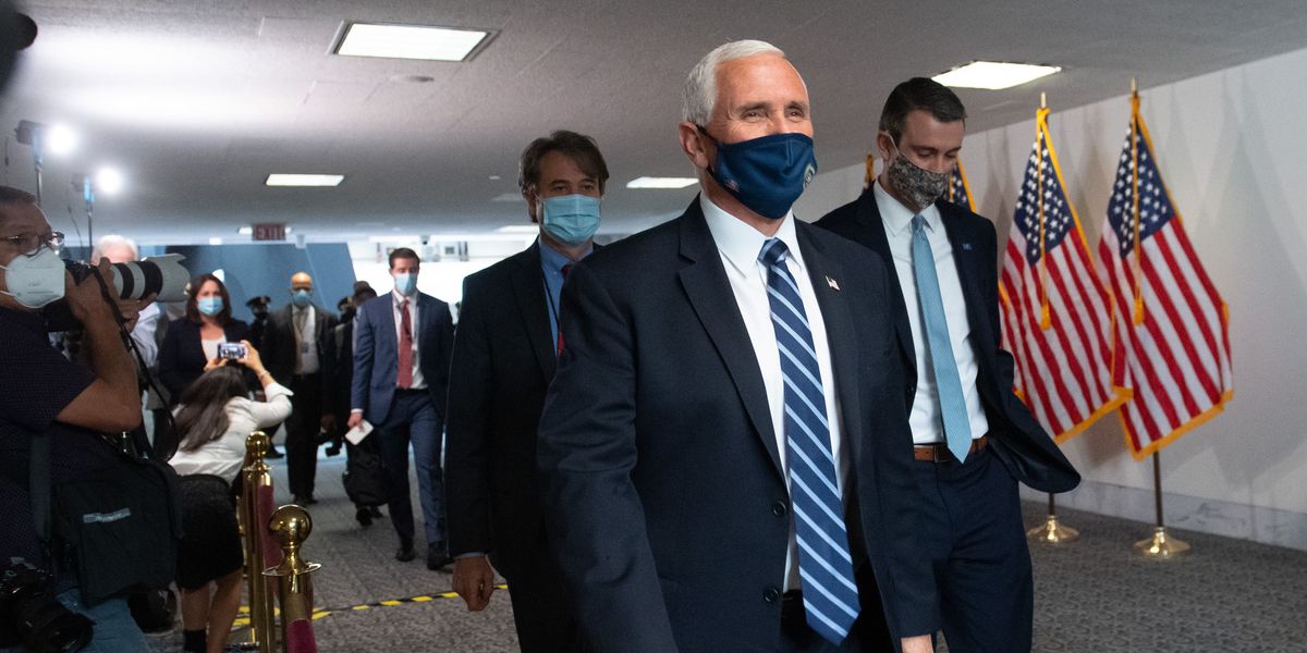 Vice President Mike Pence arrives for a Tuesday meeting with Senate Republicans.