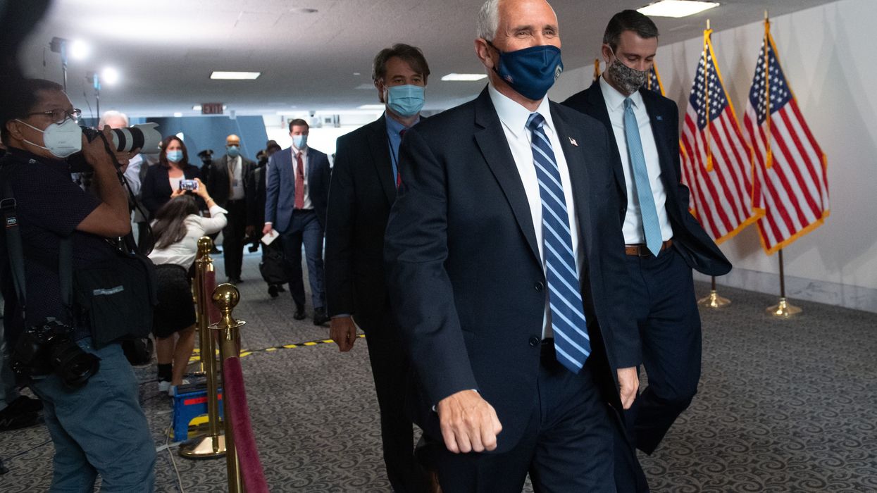 Vice President Mike Pence arrives for a Tuesday meeting with Senate Republicans.