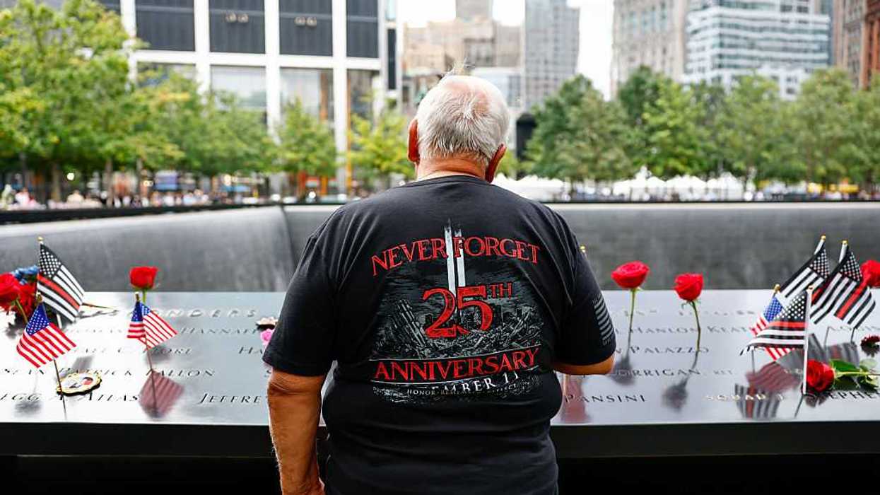 Visitor at the reflecting pools to commemorate the 25th anniversary of the September 11th terrorist attacks on the World Trade Center