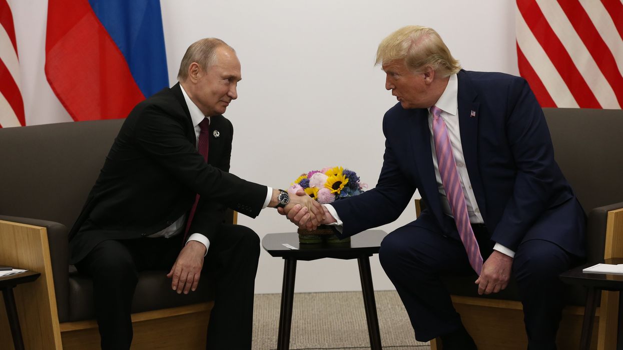 Vladimir Putin and Donald Trump shaking hands