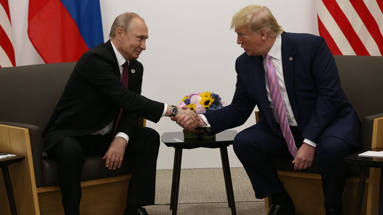 Vladimir Putin and Donald Trump shaking hands