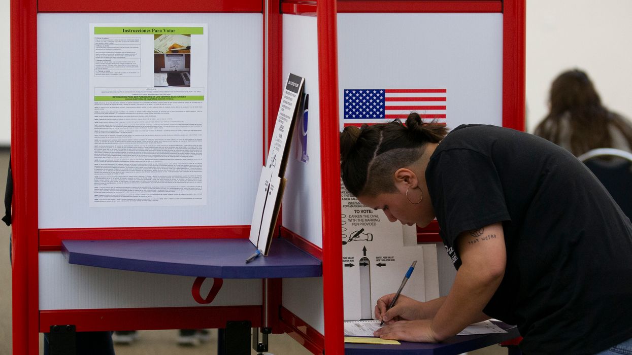 Voter filling out a ballot