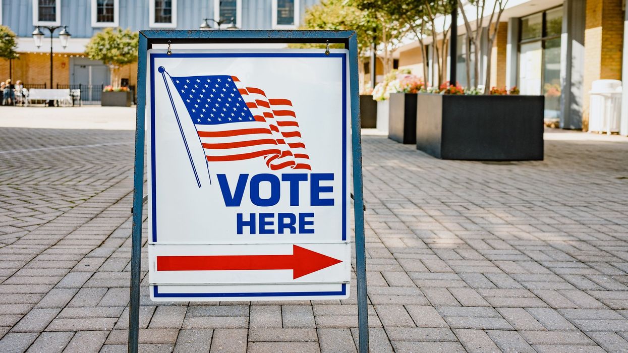 "Voter Here" sign outside of a polling location.