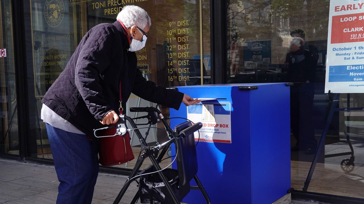 Voter using a drop box