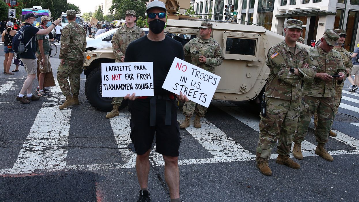 Washington, DC, protestors in front of National Guard troops