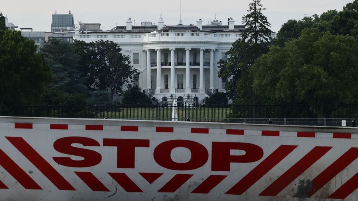 White House with "stop" barrier in front
