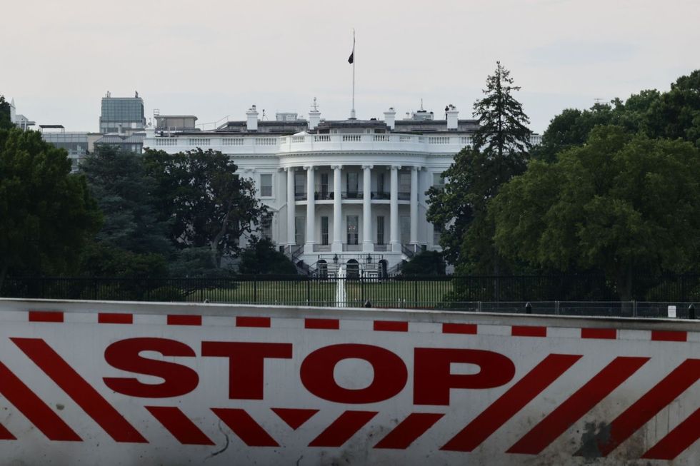 White House with "stop" barrier in front