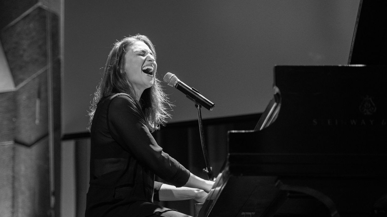 Woman playing the piano and singing