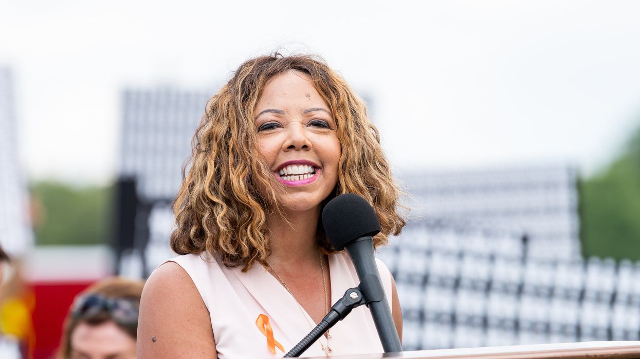 Woman speaking at a microphone