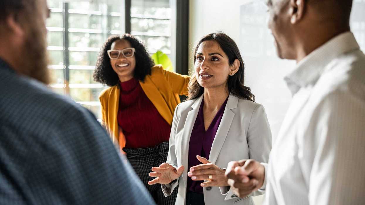 Woman talking with colleagues