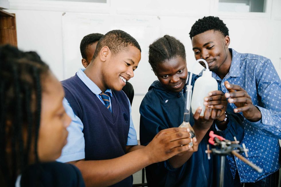 young people filling a tube