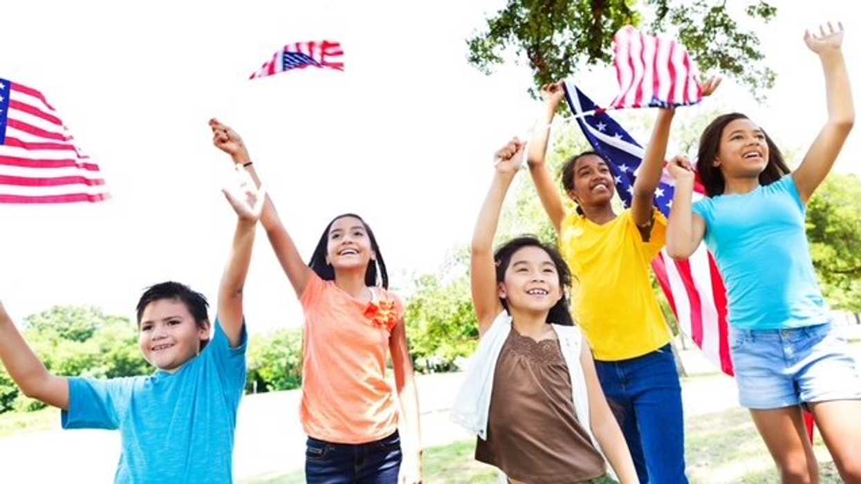 young people waving american flags